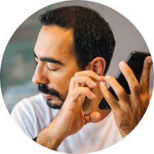 Visually impaired man using his mobile phone